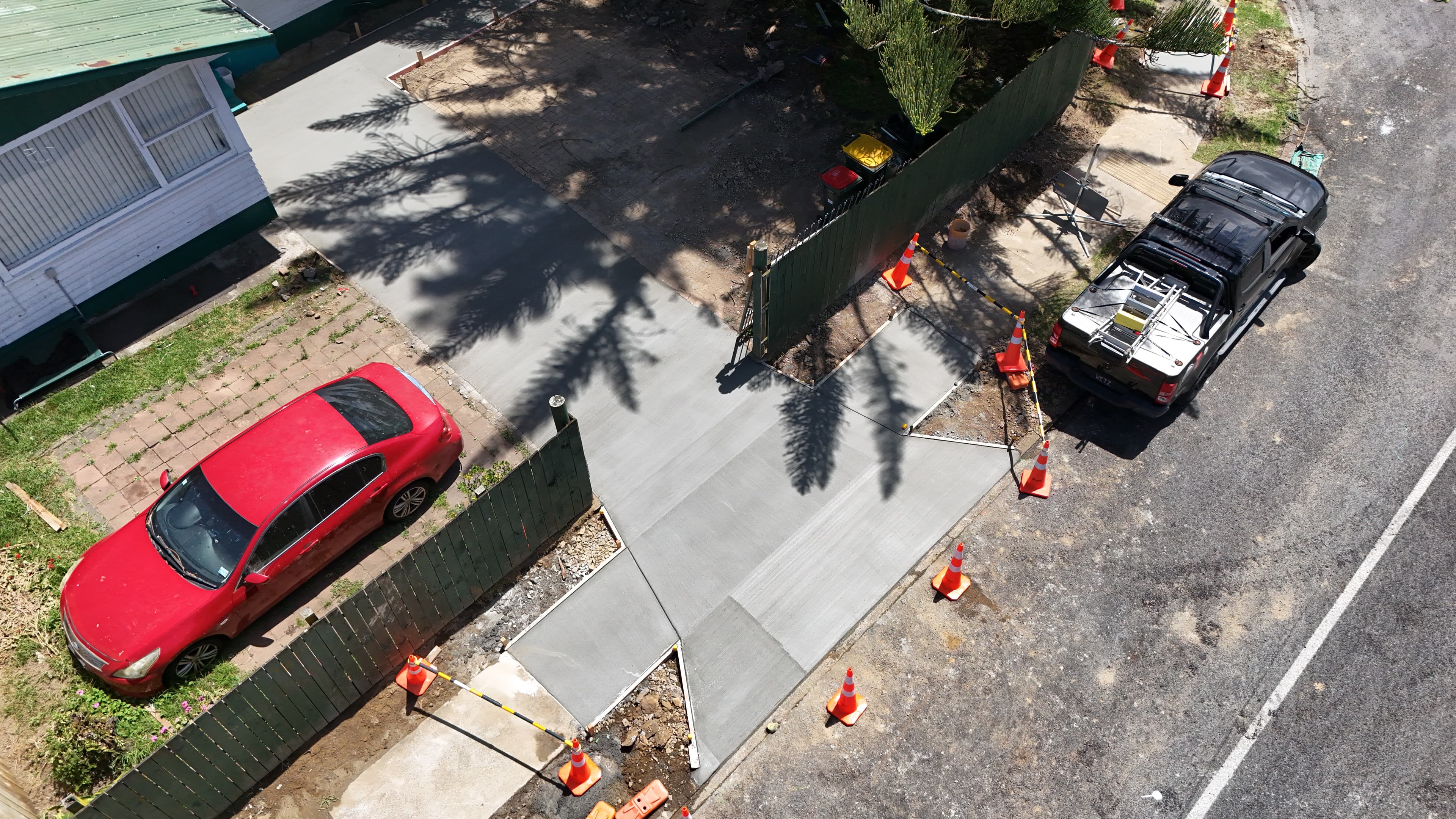 Freshly poured concrete driveway crossing on a residential street in Auckland - Bromley Group