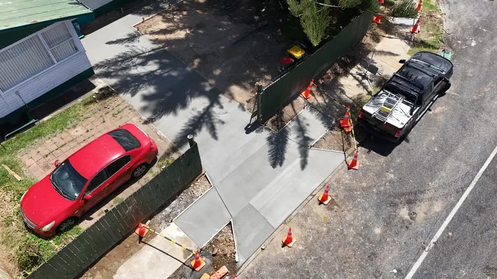 Freshly poured concrete driveway at a residential property in Auckland - Bromley Group