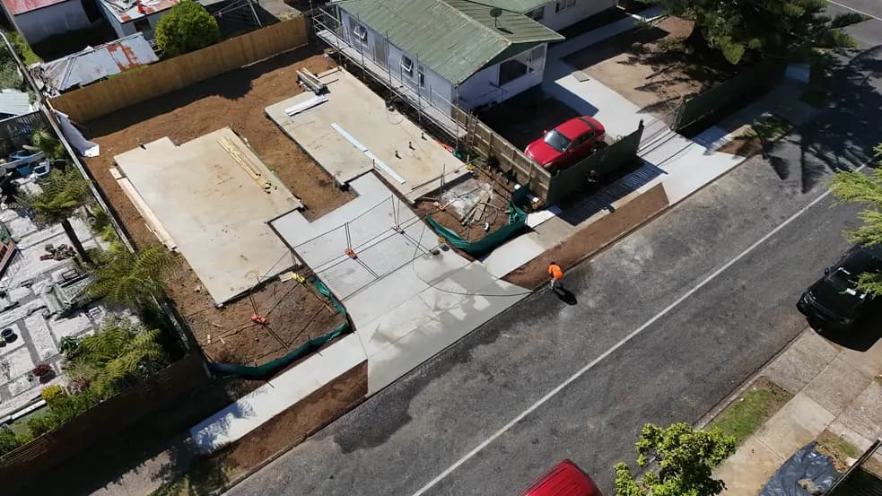 Aerial view of a new vehicle crossing and driveway pour on an Auckland street - Bromley Group