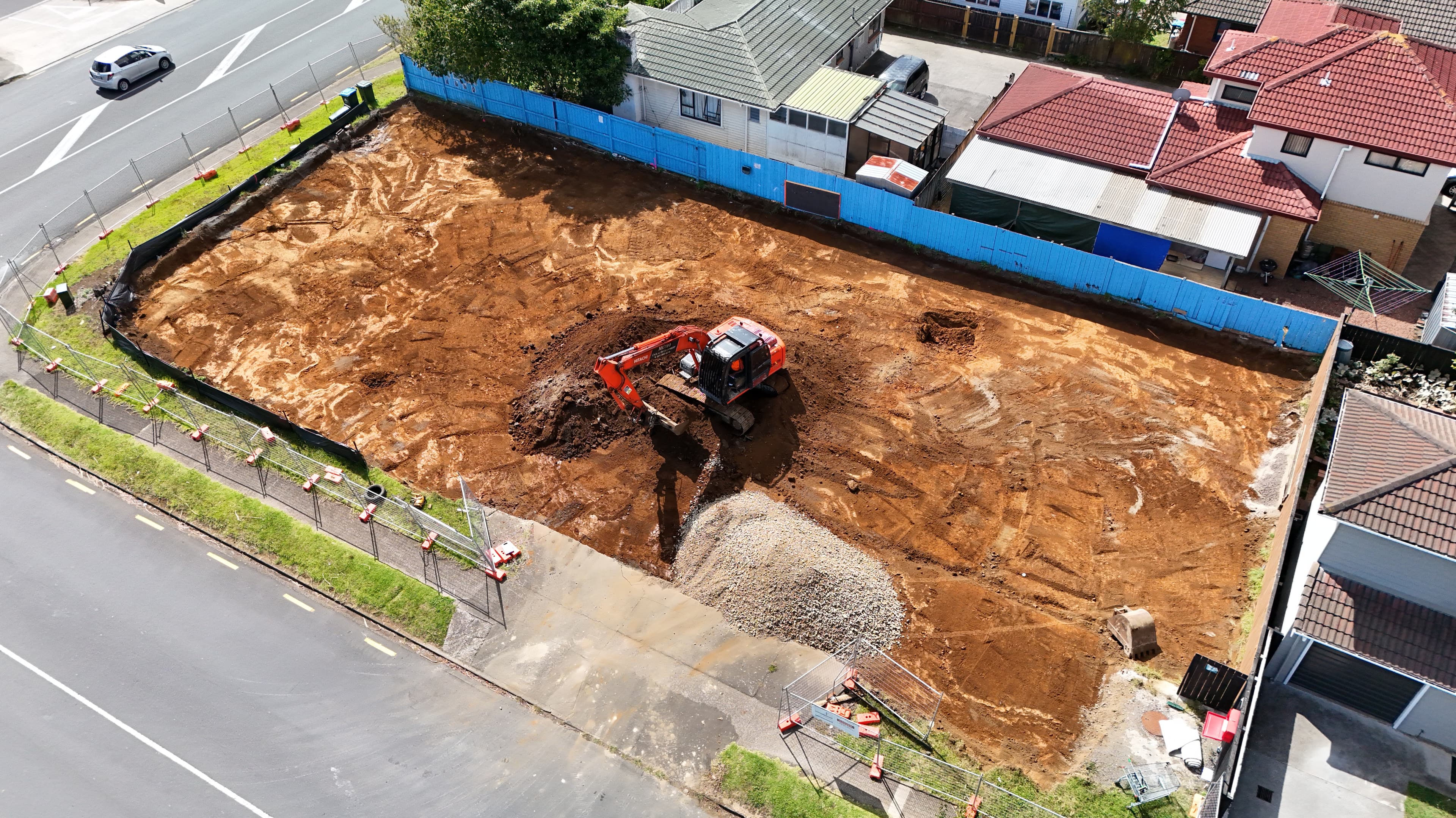 Excavator performing cut and fill earthworks on a residential section, Auckland - Bromley Group