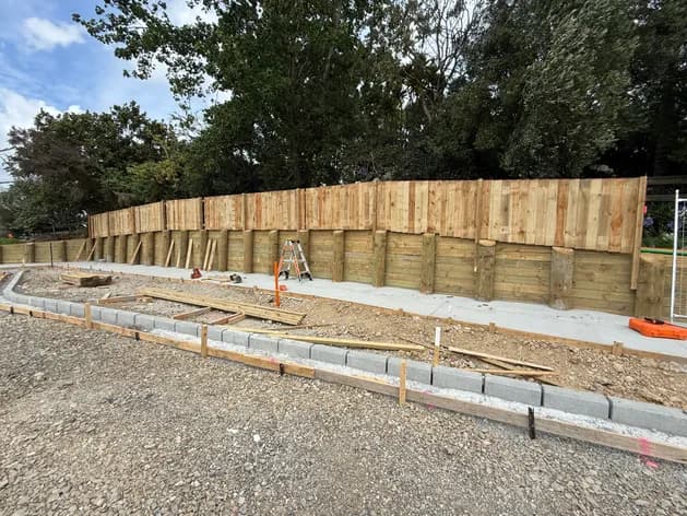 Timber retaining wall under construction on an Auckland residential site - Bromley Group